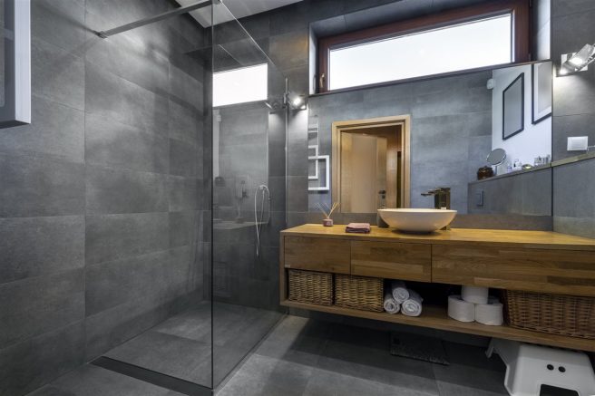There is one way to add a bathroom without busting through concrete or sacrificing the structural integrity of a home.