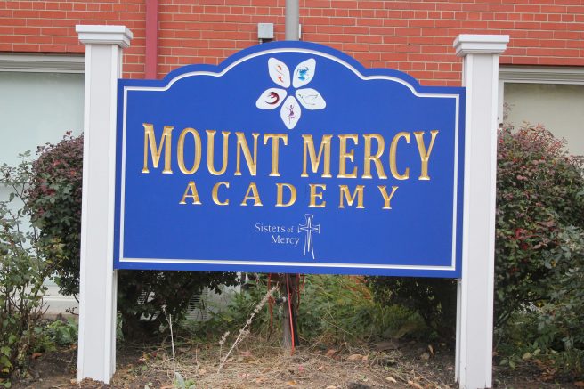 Eight Mount Mercy Academy seniors received their while lab coats.